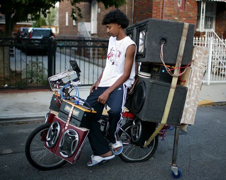 Biking On Bicycle Outfitted With Amplifiers