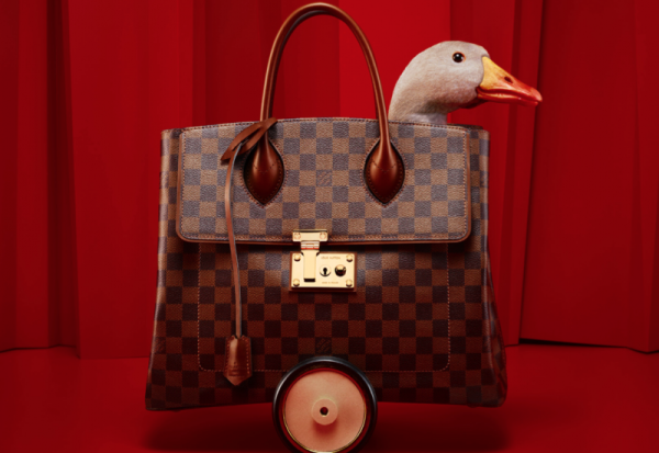 The Lucky Goose Gets Wheeled Around in LV Handbags